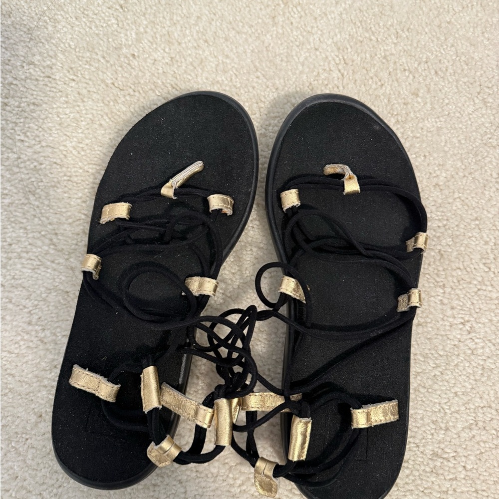 Teva Black Sandals with Gold Accent Lace-Up Straps